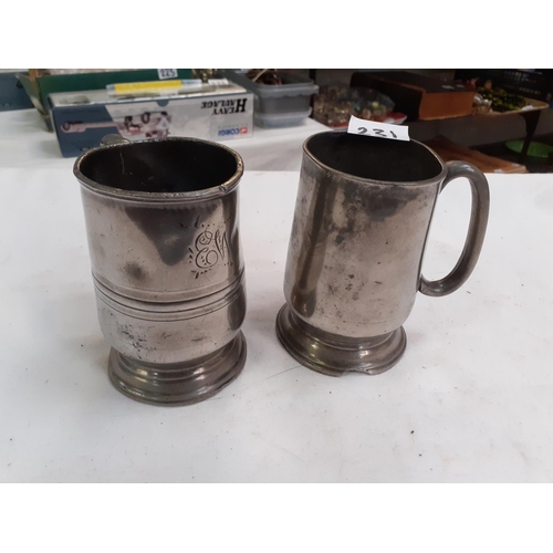 231 - Two 18th Century Pewter Half Pint Tankards - one has chip out of base.