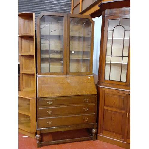 513 - Early 20th Century Oak Glazed Top Bureau Bookcase with Three Drawers on Acorn Legs.