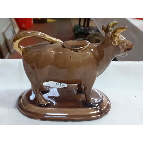 361 - Gilded Brown Cow Creamer & Cover.