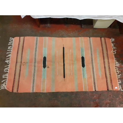 43 - Orange Striped Mat with Fringe Ends - has some stains.