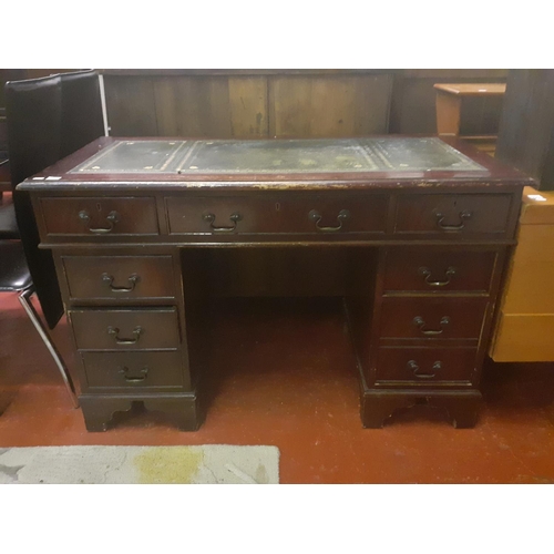 560 - Mahogany Pedestal Desk with Green Leather Top.