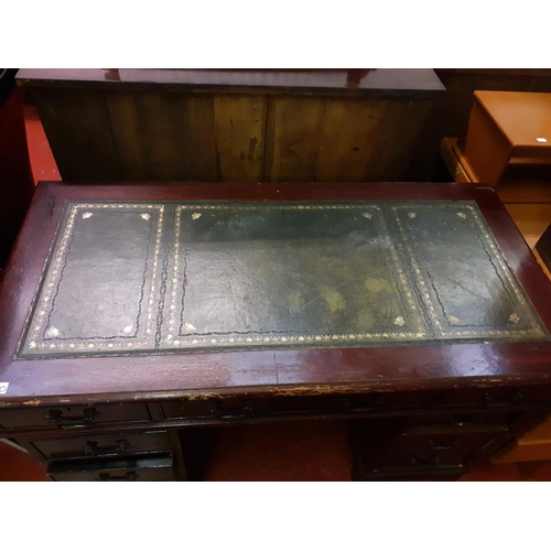 560 - Mahogany Pedestal Desk with Green Leather Top.