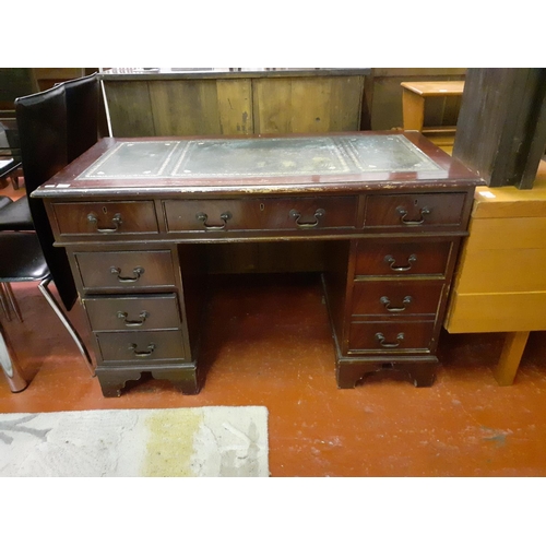 560 - Mahogany Pedestal Desk with Green Leather Top.