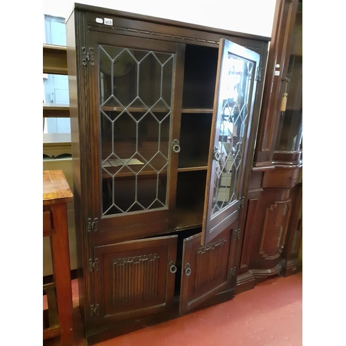 608 - Dark Oak Linen Fold Cupboard with Leaded Glass Doors to Top.