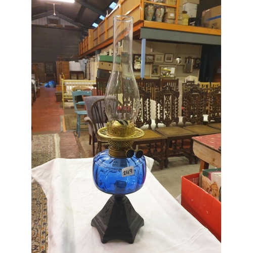 249 - Double Burner Oil Lamp with Blue Glass Bowl & Cast Base.