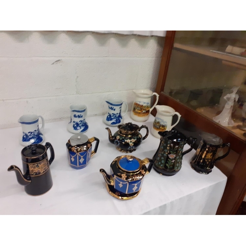 31 - Quantity of Vintage Dresser Jugs, Teapots, Hot Water Jugs Including Three Graduated Blue & White Woo... 