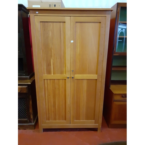 630 - Solid Oak Two Door Wardrobe with Hanging Rail & Over Shelf.