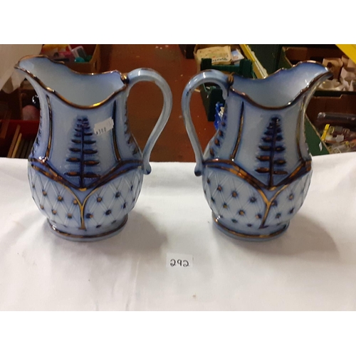 292 - Pair of Blue & White Lustred Jugs - approx 8