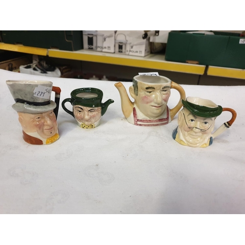 379 - Sylvac Mr Pickwick Character Jug, Lancaster Micawber Character Jug & Two Artone Character Jugs/ Tea ... 