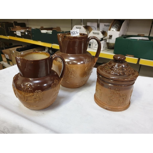 386 - Pair of Doulton Lambeth Graduated Harvest Ware Jugs & Tobacco Jar.