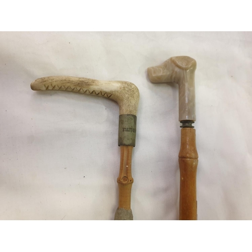 226 - Two Small Cane Sticks with Carved Handles.