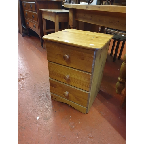 597 - Solid Pine Three Drawer Bedside Cabinet.