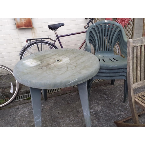 664 - Green Plastic Circular Patio Garden Table with Four Matching Chairs & Two Wooden Folding Chairs.