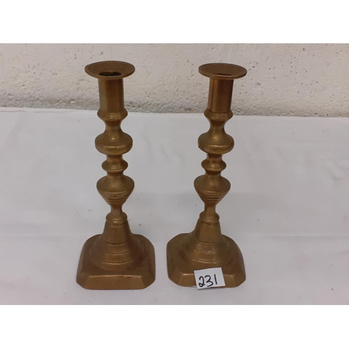 231 - Pair of Brass Candlesticks.