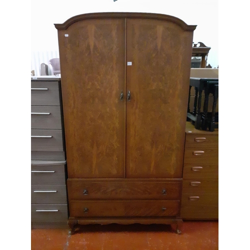 562 - Burr Walnut Finish Gents Double Wardrobe Over Two Drawers with Inner Glazed Compartments.