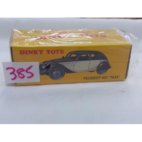 385 - Boxed Atlas Dinky Toys Peugeot 402 “Taxi” 24L.