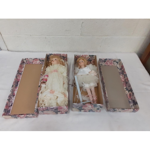 166 - Two Boxed Vintage Porcelain Dolls.