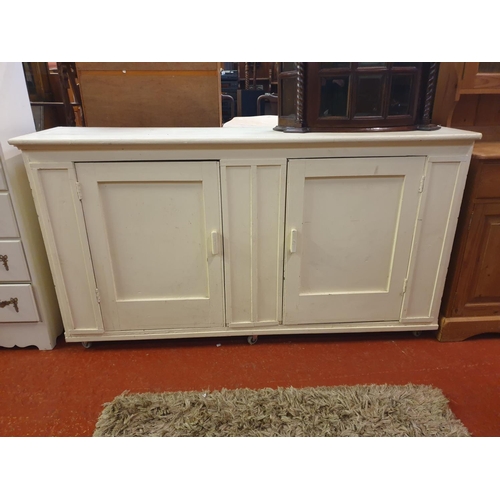 555 - Painted Pine Two Door Sideboard - 95cm tall x 172cm long x 47cm deep.