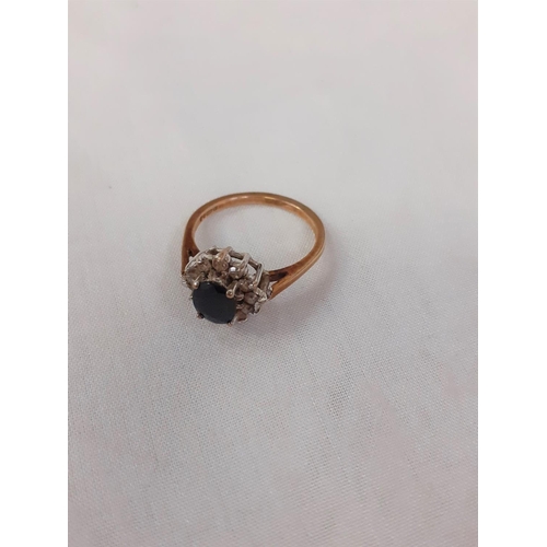 457 - Size 'M' 9ct Gold Ring with Dark Blue Sapphire & Diamond Settings.