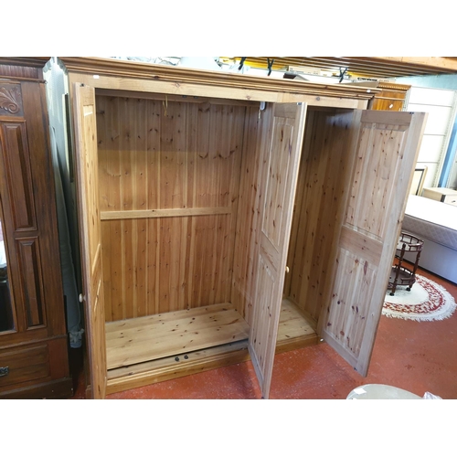 548 - Solid Pine Triple Wardrobe with Full Hanging Rails & Double Shelf.