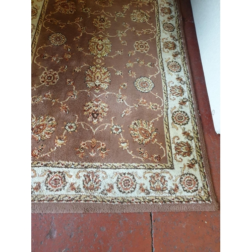 553 - Rectangular Brown Floral Patterned Rug - 1.9m x 1.33m.