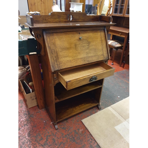 619 - Oak 1890's Student Desk with Drop Front over Single Drawer & Two Shelves.