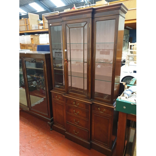 641 - Staggered Front, Glazed Top Display Unit with Four Central Doors Flanked by Twin Cupboards.