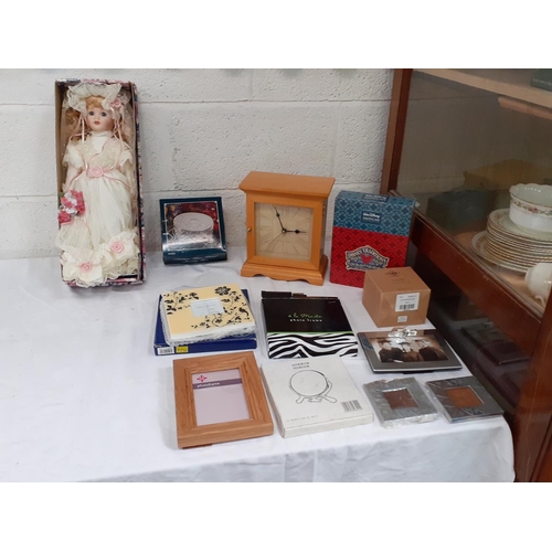 120 - Box to Include Collectable Doll on Stand, Modern Mantel Clock, Picture Frames, Willow Tree Box etc.