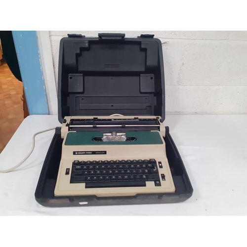 122 - Cased Silver Reed Model SP8700 Electric Typewriter.