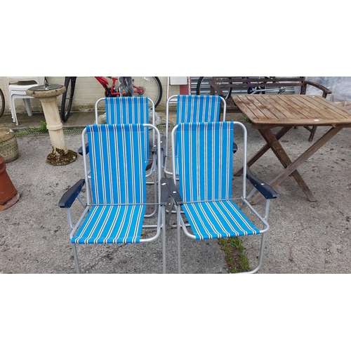 674 - Set of Four Blue Striped Folding Garden Chairs.