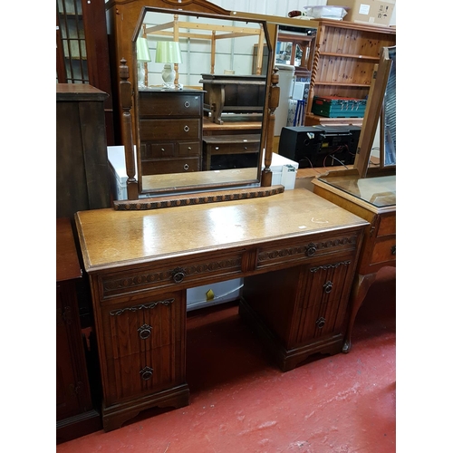 599 - Oak Six Drawer Linen Fold Dressing Table with Single Mirror Back.