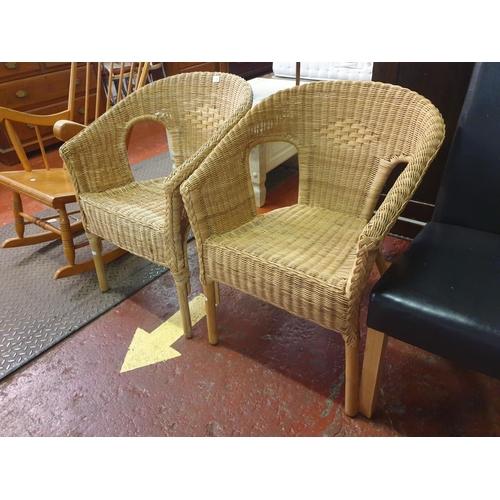 488 - Two Woven Wicker Arm Chairs.