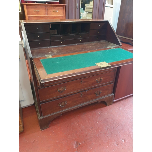 584 - Mahogany Drop Front Writing Bureau Over Four Drawers - 103cm tall x 92cm wide x 51cm deep.