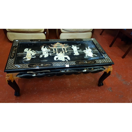 536 - Inlaid Black Lacquered Oriental Coffee Table - 42cm tall x 103cm long x 53cm wide.