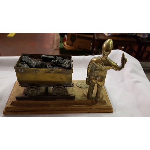 238 - Brass Miner & Cart Scene on Wooden Plinth.