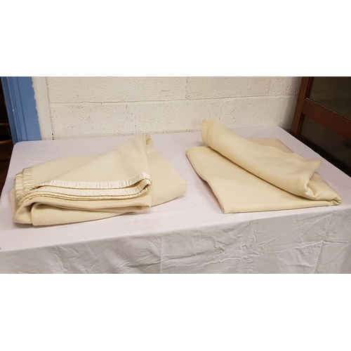 32 - Two Cream Woollen Blankets.