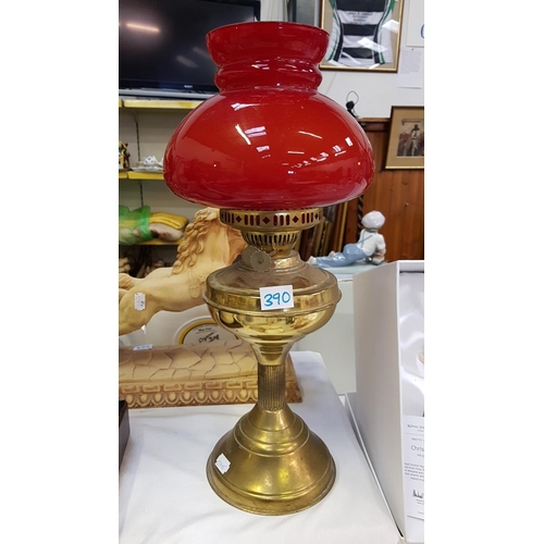 390 - Brass Based Double Burner Oil Lamp with Red Glass Shade - approx 18.5