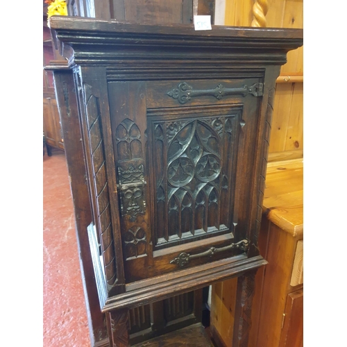 515 - Antique Carved Dark Oak Cupboard with Attached Legs - 127cm tall  x 47cm wide x 38cm deep.