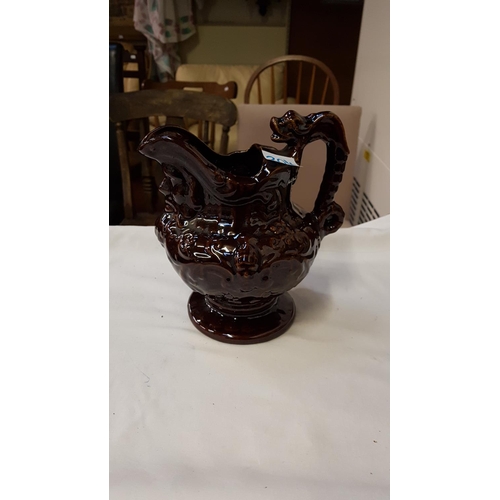 304 - Vintage Brown Treacle Jug with Mask Head Spout.