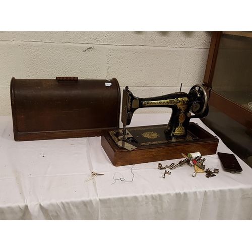 102 - Oak Cased Singer Sewing Machine.