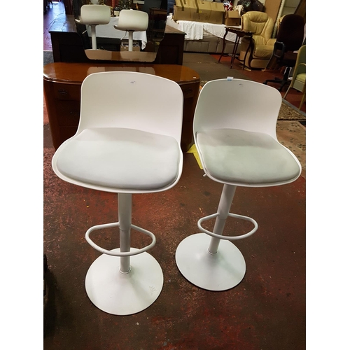 506 - Pair of White Hydraulic Adjustable Stools.