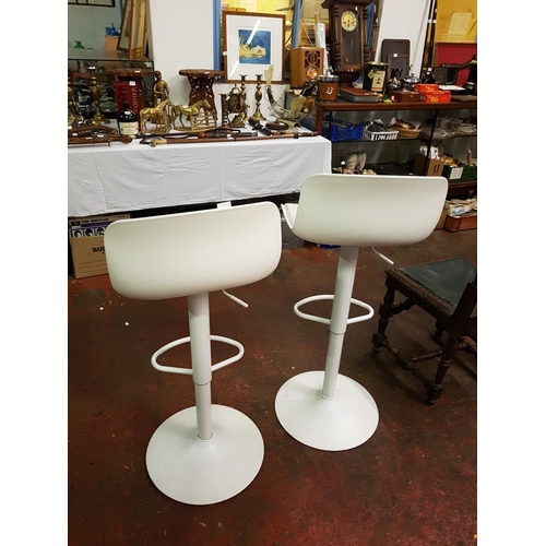 506 - Pair of White Hydraulic Adjustable Stools.