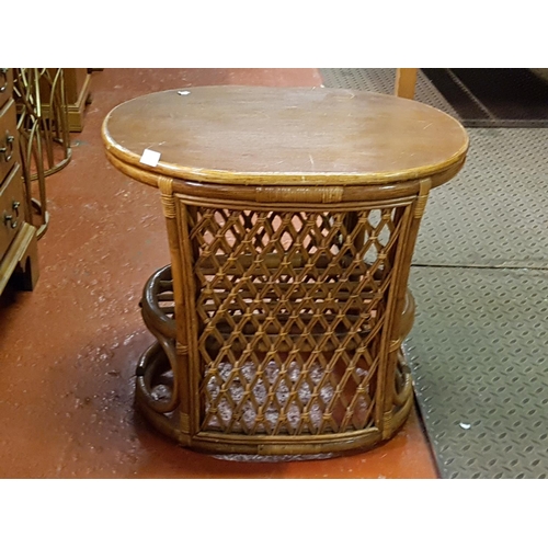 515 - Solid Topped Cane Oval Side Table - Approx 55cm tall x 62cm wide x 49cm deep.