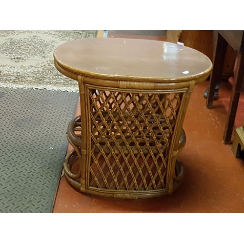 515 - Solid Topped Cane Oval Side Table - Approx 55cm tall x 62cm wide x 49cm deep.