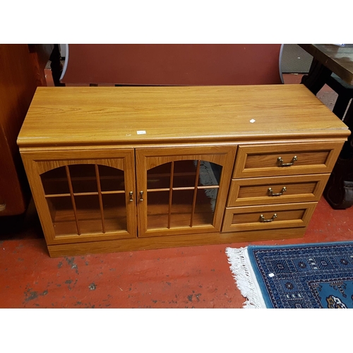 550 - Pine Effect TV Unit with Two Glazed Doors and Three Drawers - 2ft tall x 47