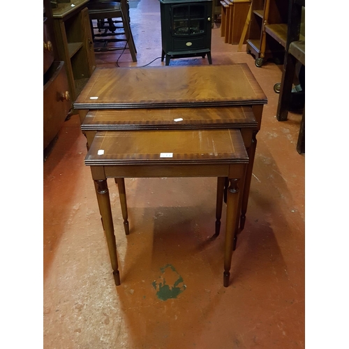 551 - Nest of Three Polished Mahogany Tables.