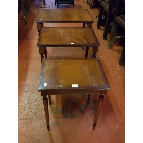 551 - Nest of Three Polished Mahogany Tables.