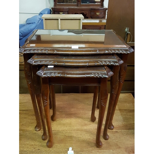 553 - Nest of Three Mahogany Tables with Glass Inlays.