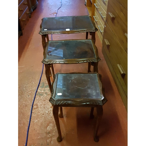 553 - Nest of Three Mahogany Tables with Glass Inlays.