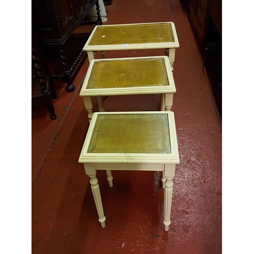 593 - Nest of Three Cream Tables with Tan Leather Inlay Top.